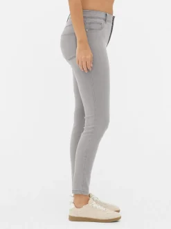 Jeansy ze średnim stanem o kroju skinny | standard