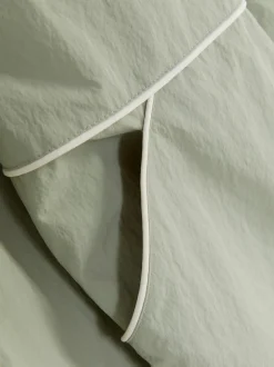 Kurtka przeciwdeszczowa z ozdobną lamówką