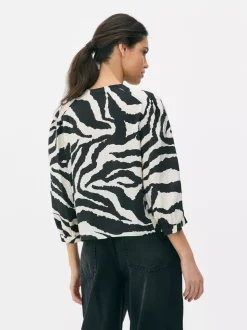Bluzka w zebrę z bufiastym rękawem Paula Echevarría