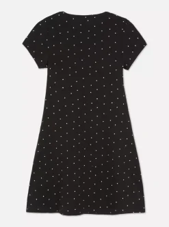 Dżersejowa sukienka w kropki z dekoltem w serek
