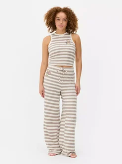 Dzianinowa piżama w paski z motywem Kubusia Puchatka