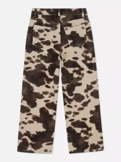 Jeansy z szerokimi nogawkami w krowie łaty