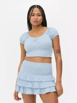 Krótki top z nadrukiem i marszczeniami od zestawu