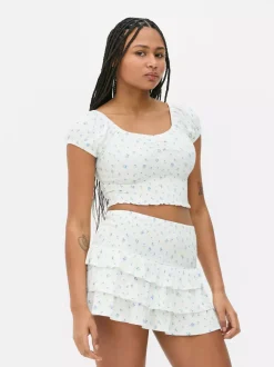 Krótki top z nadrukiem i marszczeniami od zestawu