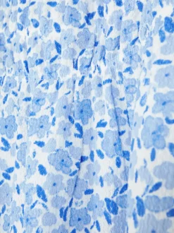 Luźna sukienka w kwiaty z bufiastymi rękawami