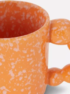 Nakrapiany kubek z uchem w kształcie bąbelków