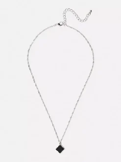 Naszyjnik z abstrakcyjną kwiatową przywieszką