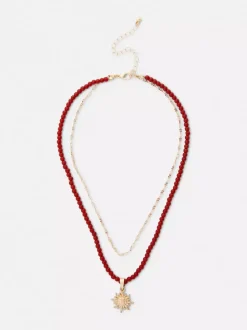 Naszyjnik z koralików z wisiorkiem z motywem słońca