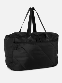 Pikowana torba kabinowa mieszcząca się pod fotelem