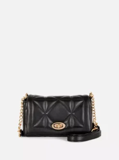 Pikowana torba na ramię z obracaną klamrą