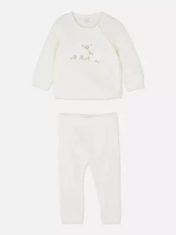 Pikowany komplet z topem i spodniami z aplikacją