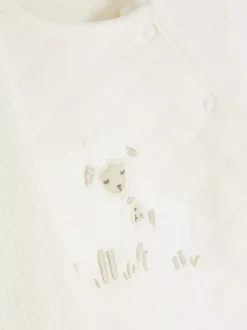 Pikowany komplet z topem i spodniami z aplikacją