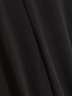 Prążkowane spodnie z rozszerzaną nogawką