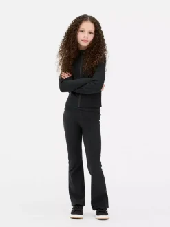 Rozciągliwe legginsy sportowe z rozszerzaną nogawką