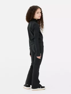 Rozciągliwe legginsy sportowe z rozszerzaną nogawką