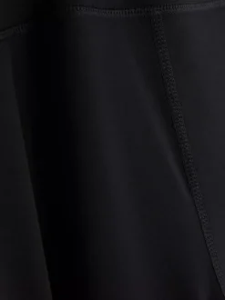 Rozciągliwe legginsy sportowe z rozszerzaną nogawką