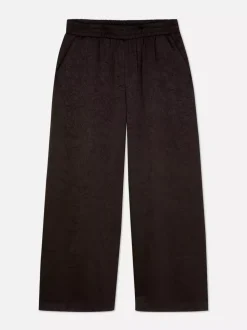 Satynowe spodnie z szeroką nogawką The Edit