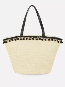 Słomkowa torba typu bucket z pomponikami