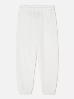 Spodnie dresowe ze ściągaczami i motywem Disneya