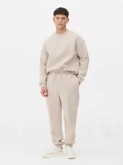 Spodnie dresowe ze ściągaczami i zaszewkami Kem