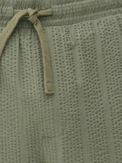 Spodnie w paski z tkaniny seersucker