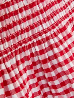 Sukienka w kratkę z marszczeniami i niskim stanem