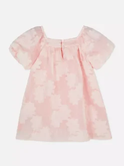 Sukienka z bufiastymi rękawami w kwiaty