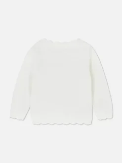 Sweter rozpinany z muszelkowym wykończeniem