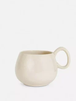 Szkliwiony kubek z nakrapianym wzorem