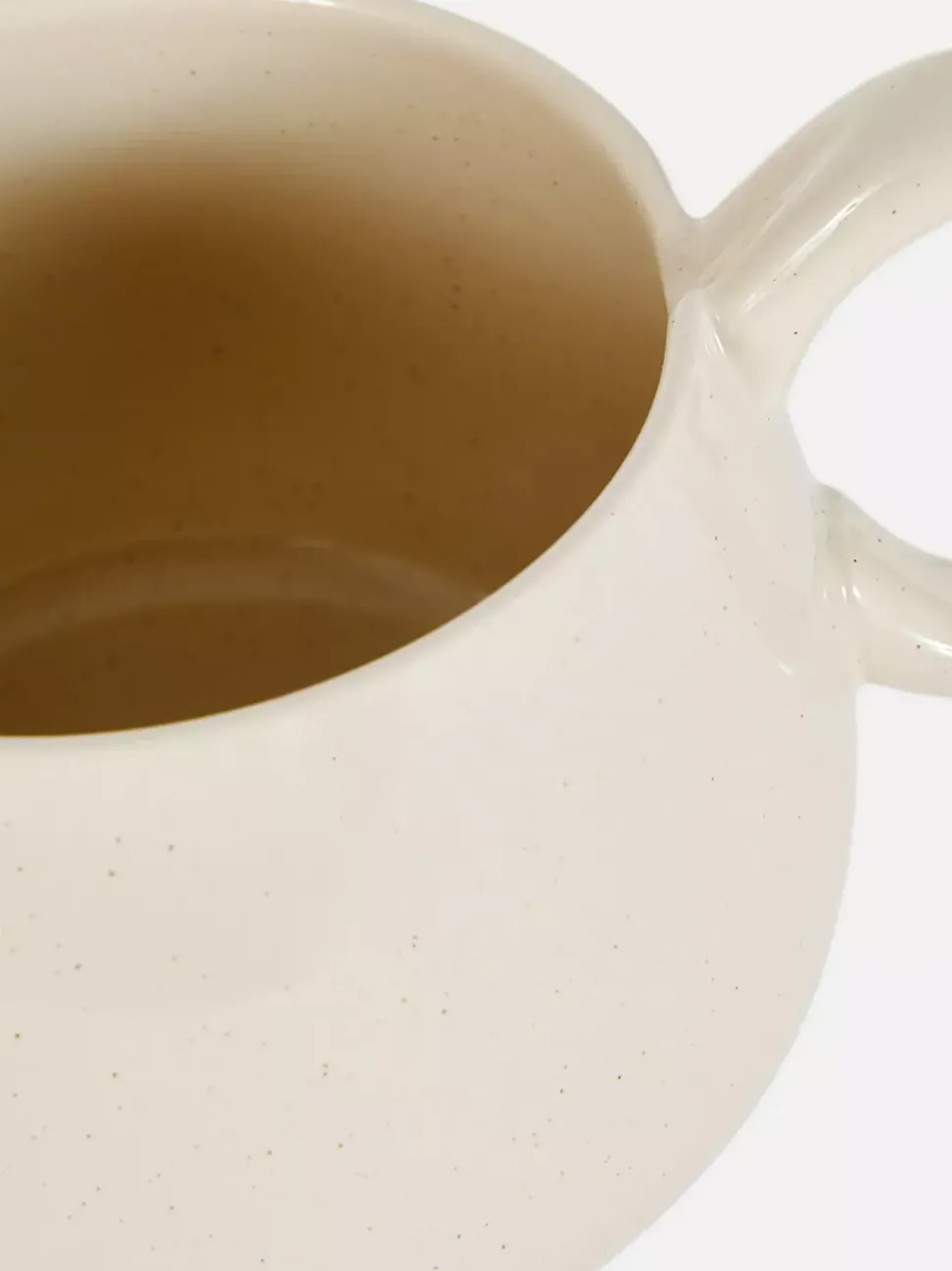 Szkliwiony kubek z nakrapianym wzorem