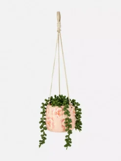 Sztuczna roślina pnąca w wiszącej doniczce