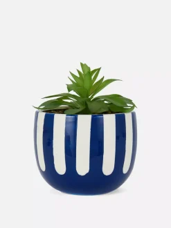 Sztuczny sukulent w pasiastej doniczce