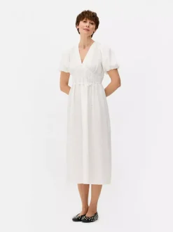 Teksturowana sukienka midi na guziki