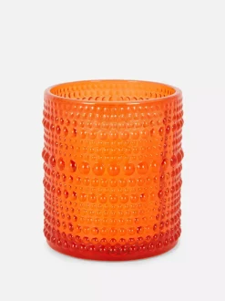 Świeca w szkle o bąbelkowej powierzchni