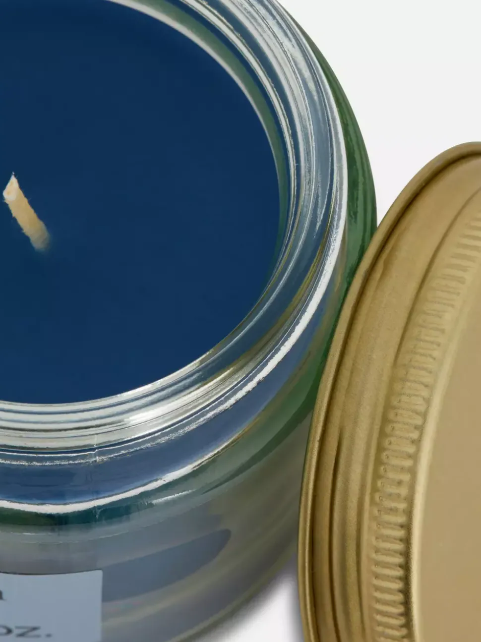 Świeca zapachowa w małym słoiczku z pokrywką