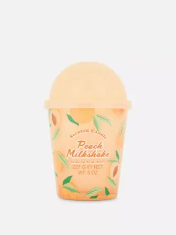 Świeca zapachowa w pojemniku przypominającym kubek