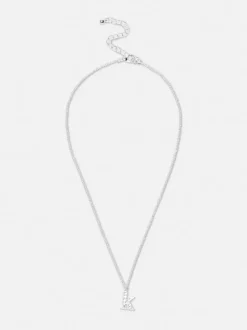 Wisiorek z inicjałem ze strasami