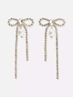 Wiszące kolczyki w kształcie kokardki z diamencikami