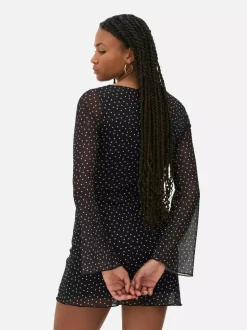 Wzorzysta siateczkowa sukienka mini z dżerseju