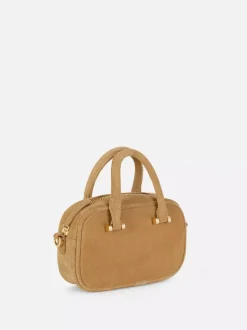 Zamszowa minitorebka typu kuferek Rita Ora